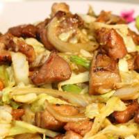 Mongolian Chicken · Marinated slices of tenderized chicken stir-fried with onions and green onions.