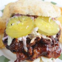 Bbq Sandwiches · Pork, Brisket or Chicken, white cheddar, dill pickles homemade BBQ sauce topped with coleslaw.