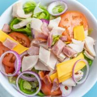 Chef Salad · Julienne ham, turkey and American cheese with tomato and hard boiled egg on a bed of fresh g...