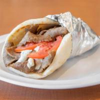 Gyros Pita · Chicago style gyros broiled on vertical skewer served with onions, tomatoes, and tzatziki sa...