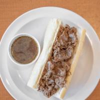 Italian Beef · Chicago style beef dipped served on french bread. We recommend adding hot or sweet peppers a...