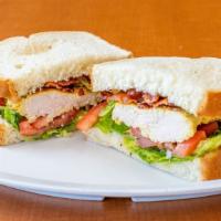 Chicken B.L.T. · Grilled breast of chicken with bacon, lettuce, tomato, cheese and mayo served on white toast.