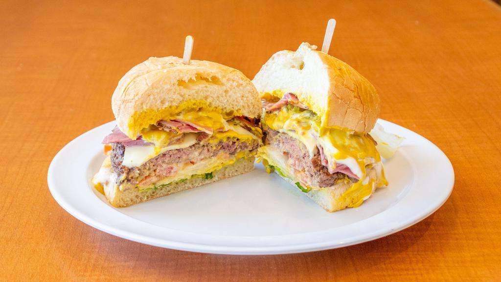 Pastrami Burger · (Meat lovers dream) juicy pastrami plus a 1/3 pound burger patty with swiss cheese, mayo, lettuce, tomatoes, onions, pickles and mustard.
