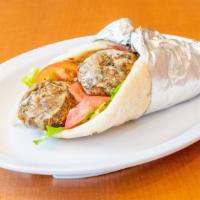 Falafel Pita · Vegetarian. Mix of chickpeas, onions, garlic, parsley, served with lettuce, tomatoes and tah...