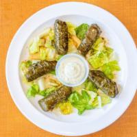 Dolma (Vegetarian) · Grape leaves stuffed with rice, parsley, tomatoes, onions, dill, garlic, fresh herbs, spices...