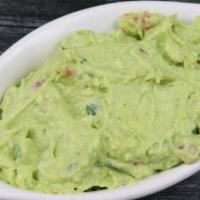 Guacamole · Mezcla de Aguacate maduro  con tomate  y cilantro.
Smashed ripe avocado, tomato and cilantro.