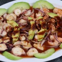 Botana De Camaron Y Pulpo · Camaron cocido y pulpo para picar, aguacate, pepino y cebolla. 
Cooked shrimp and octopus, a...