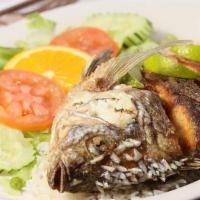 Mojarra Frita · fried fish, salad and rice.