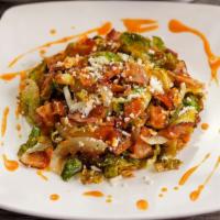 Crispy Brussel Sprouts · smoked bacon + grilled onions + chipotle agave vinaigrette + cotija cheese