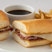 Classic French Dip · Layers of premium roast beef on a grilled hoagie roll with Swiss cheese and a side of tradit...