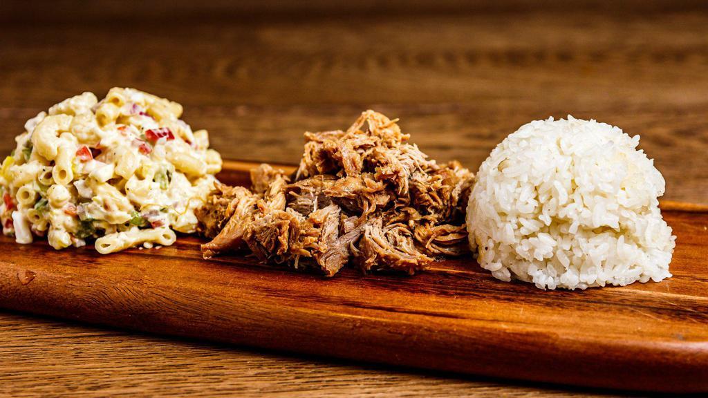 Kalua Pork Plate · Hana’s slow-roasted pork served with a side of white rice and macaroni salad.