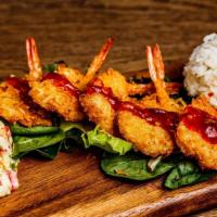 Coconut Shrimp Plate · Butterfly shrimp in a coconut batter and lightly fried served with two sides. Please contact...