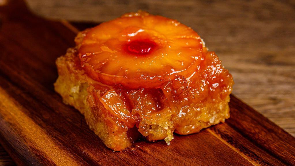 Pineapple Upside Down Cake · House-made soft and buttery cake with a caramelized brown sugar pineapple ＆ cherry topping.