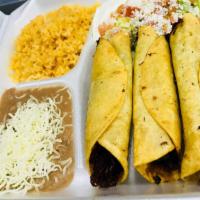 Taquitos Rancheros · (Flautas) Comes with shredded beef only, with rice and beans, lettuce, sour cream, guacamole...