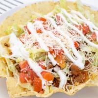 Taco Salad · Bowls tortilla, comes with rice, beans, any choice of the meat, lettuce, sour cream, tomatoe...