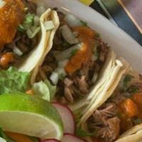 (2) Tacos De Carne O Pollo Combo · Two shredded beef or chicken tacos.