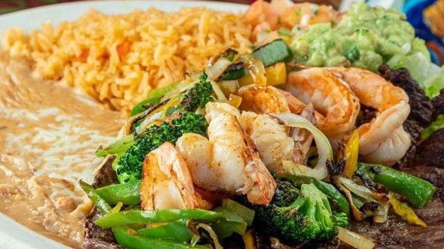 Molcajete Mixto · Camarón, carne, pollo, queso, nopal y cebollitas shrimp, steak, chicken, cheese, cactus and cambray onion.