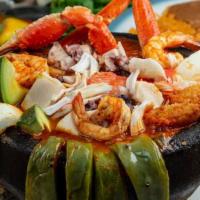 Molcajete De Mariscos · Octopus, crab, shrimp, abalone, fish, cheese, cactus and cambray onion.