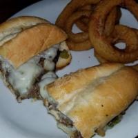 Philly Oheese Steak · Thinly sliced ribeye steak, onion, bell pepper, and mozzarella cheese.