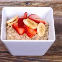 Power Oatmeal Breakfast · Organic Oatmeal topped with Banana, Strawberry and
 a touch of Organic Agave Nectar. 
(430ca...