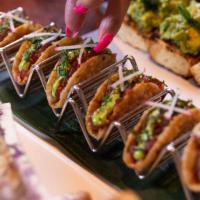 Tuna Poke Wonton Tacos · chiffonade cilantro, radish, wasabi kewpie.