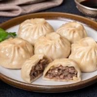 Buzz / Traditional Steamed Soup Dumpling (12Pcs) · Traditional Mongolian steamed soup dumpling. Ingredients: hand chopped Angus beef, onion, ga...