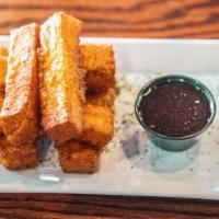 Idaho Cheese Sticks · Idaho's Ballard family farms halloumi cheese fried and presented with Marion berry coulis.
