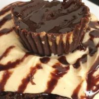 Peanut Butter Pie Roll · Peanut butter frosting: topped with peanut butter cups, Pie crumble & Chocolate Sauce