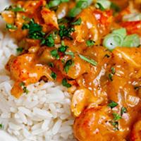 Crawfish Etouffee · Cajun stew made with crawfish, andouille sausage, and vegetables served over rice.