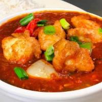 Chicken Schezwan · Fiery red Schezwan sauce, tempered with ginger garlic, and chicken. Served with steamed rice.