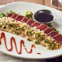 Tempura Crunch Sashimi Tuna* · Sushi-grade tuna, seared rare and sliced, with sashimi sauce and tempura flakes. Served with...