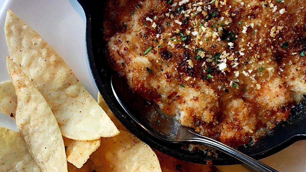 Imperial Dip · Delicious blend of tender shrimp, lump crab, Mozzarella and Parmesan cheeses, served with seasoned house-made tortilla chips.