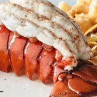 Cold Water Lobster Tails · A pair of 5-6 oz lobster tails, seasoned and steamed, served with warm drawn butter