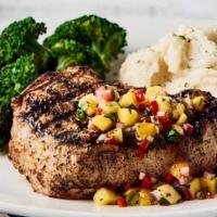 Bone-In 12Oz Pork Chop · lightly seasoned and wood-grilled and served with choice of two signature sides