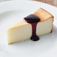Cheesecake · Classic New York-style cheesecake with raspberry sauce