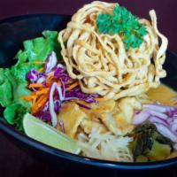 S- 12 Kao Soi · Choices of meat chicken, tofu, or vegetarian with steamed egg noodle in our Northern Thai st...