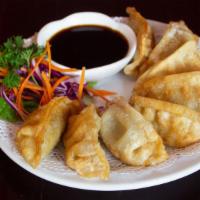 Pot Stickers · Deep-fried or steamed pork and vegetable dumpling. Served with black sweet soy sauce.