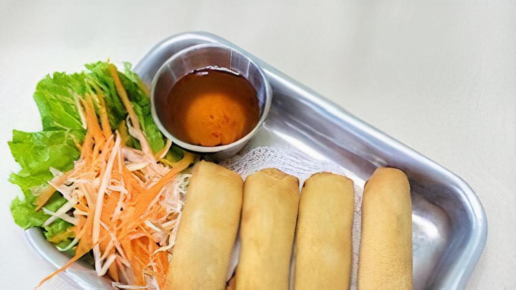 Crispy Egg Rolls · Deep-fried roll stuffed with glass noodles and mixed vegetable. Served with sweet-sour sauce.