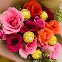 Pinks · A mixture of pink tone roses, with chocolate truffles, wrapped in kraft paper  sheets and li...