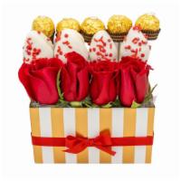 A Little Of Everything Gold  · Gold and 4 red rose arrangement with 4 gold chocolate covered strawberries wrapped in cellop...
