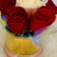 Red White And Pink Round  · 6 rose arrangement
One single white rose surrounded by red roses.