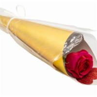 Rose On A Cone · Single red rose in a gold and brown cone along a cute red heart decoration.