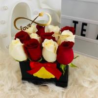 I Love You To Infinity  · 1 dozen of red and white rose mix boxed with an infinity love sign and a single butterfly to...
