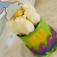 Mermaid Birthday  · Mermaid birthday white rose arrangement with a single chocolate truffle in the middle to swe...