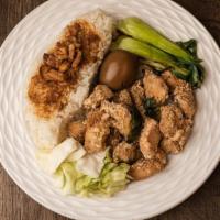 Popcorn Chicken Over Rice · All rice dishes include an egg, Taiwanese style kimchi, and vegetables.