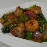 Sesame Scallops · Crispy fired scallops tossed in a sweet and spicy sesame sauce on a bed of veggies.
