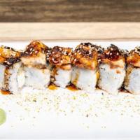Dragon Roll · Cucumber, cream cheese, shrimp tempura, topped with eel and eel sauce.