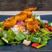 Honey Hot Shrimp · Grilled shrimp, honey hot sauce, white rice and seasoned vegetables.