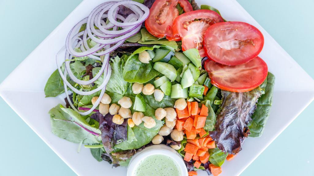 Veggie Salad · Tomatoes, red onions, carrots, cucumbers, chickpeas, mixed greens.