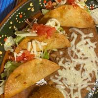 Crispy Tacos Chicken  · Three crispy tacos, rice, beans, cheese and tomato.